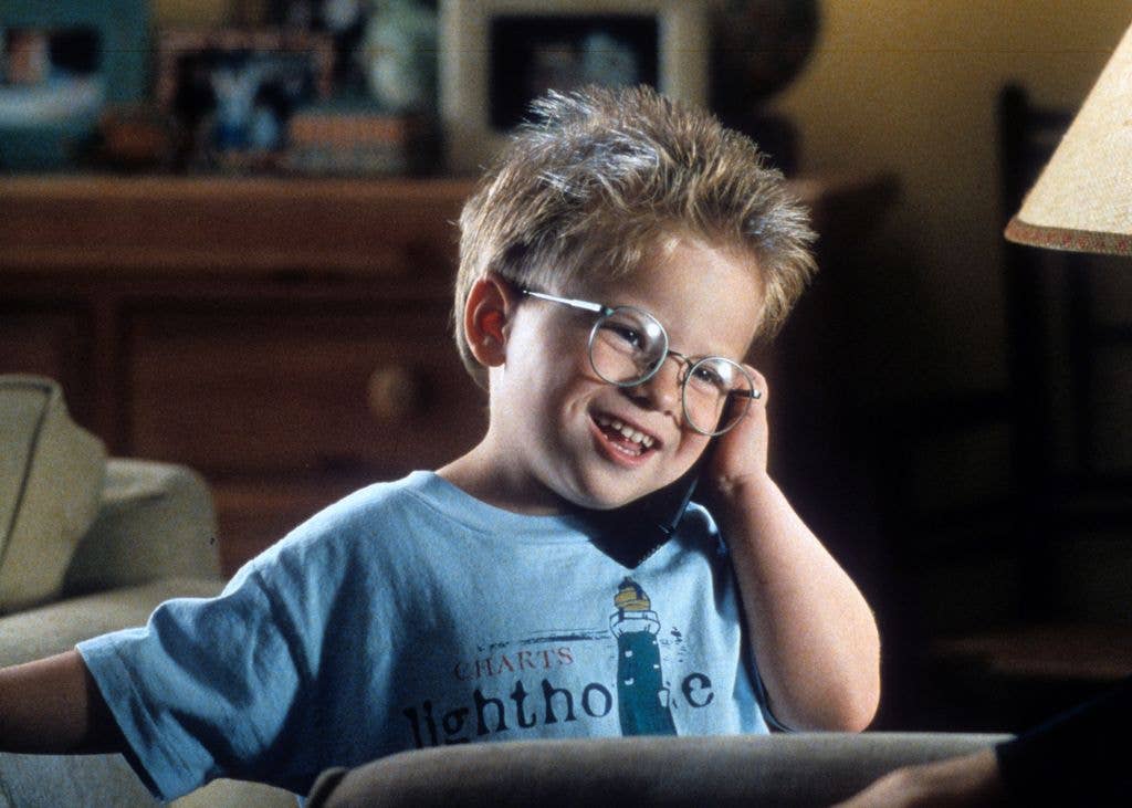 Jonathan Lipnicki talks on a phone in a scene from the film 'Jerry Maguire', 1996