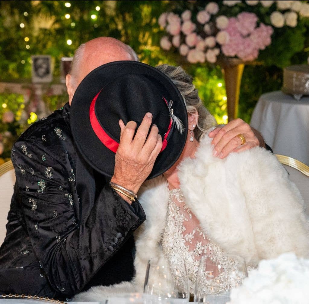 Mick Fleetwood and Elizabeth Jordan hide behind a fedora hat