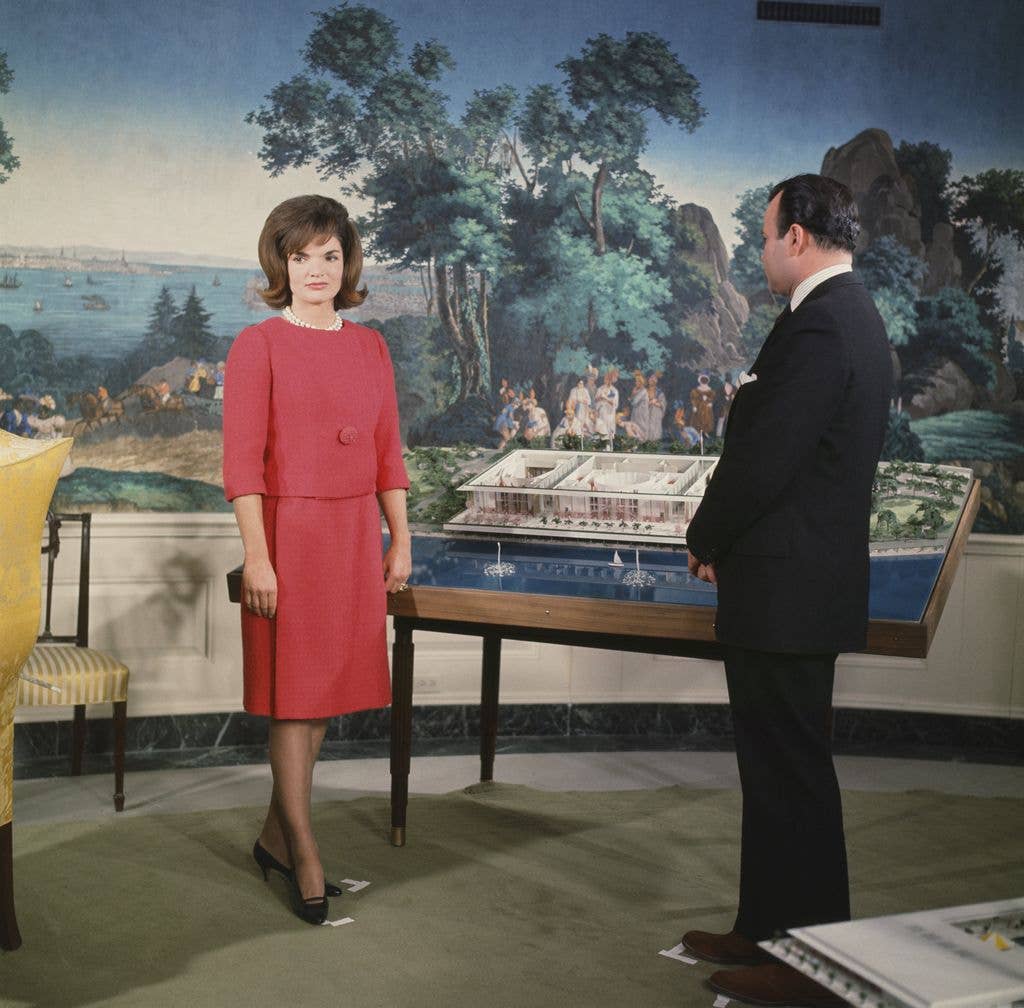 11/11/1962 -- Pictured: (l-r) First Lady Jacqueline Kennedy, NBC News' Sander Vanocur discussing plans for the new National Culture Center (later renamed The Kennedy Center) in the Diplomatic Reception Room of the White House on November 5, 1962