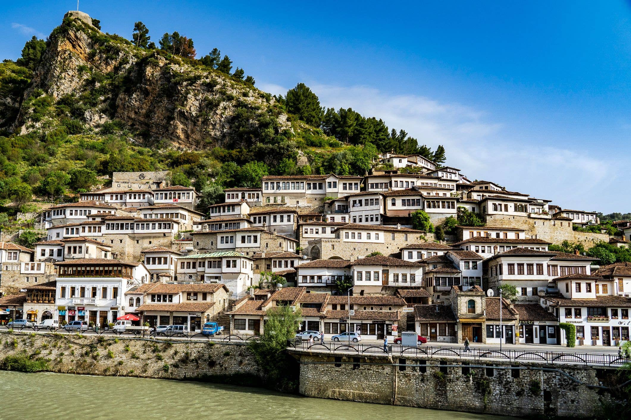 Berat is known as the City of a Thousand Windows because of its snow-white Ottoman houses stacked like dominoes along a steep hillside