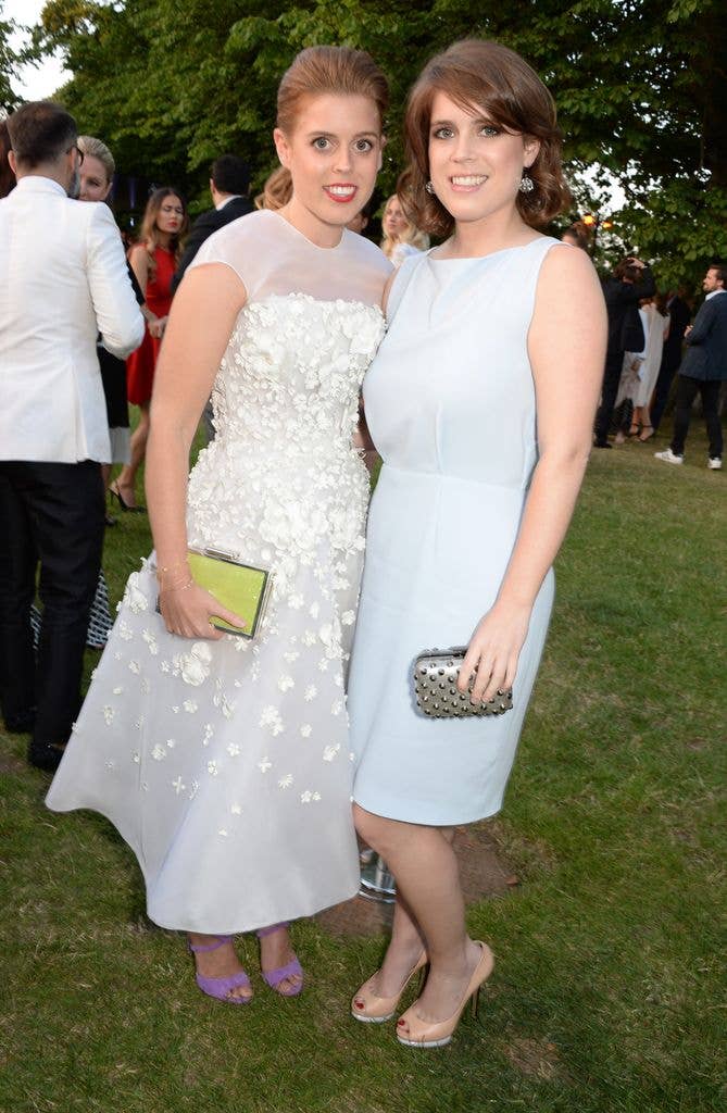 Princess Beatrice in white alongside her sister Princess Eugenie