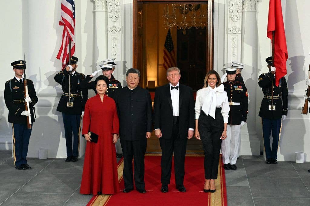 (From L) China's First Lady Peng Liyuan, China's President Xi Jinping, US President Donald Trump and US First Lady Melania Trump