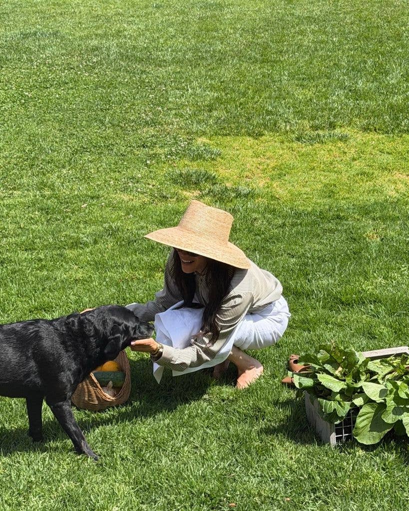 meghan markle cuddling pula outside