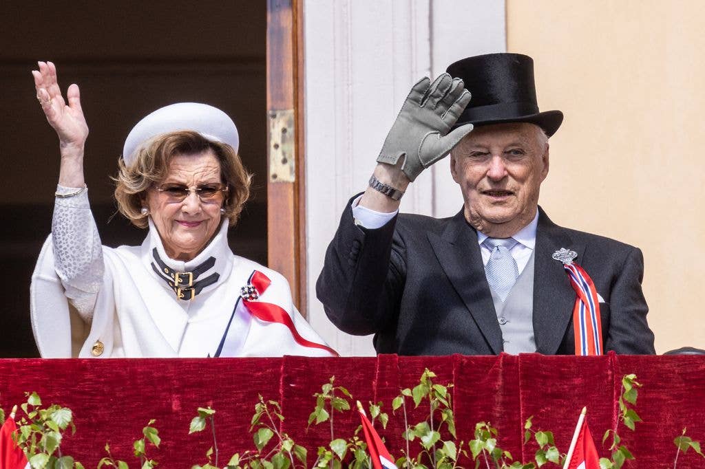 Queen Sonja and King Harald attend the children's parade at the Royal Castle on Norway's National Day