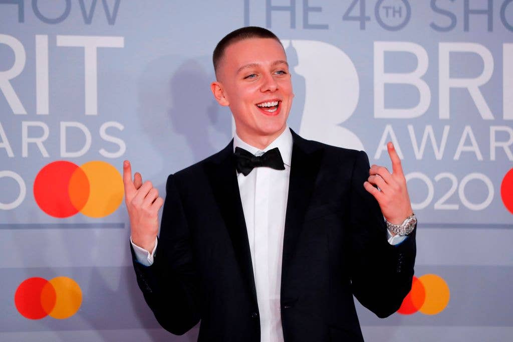 Aitch posing on the red carpet