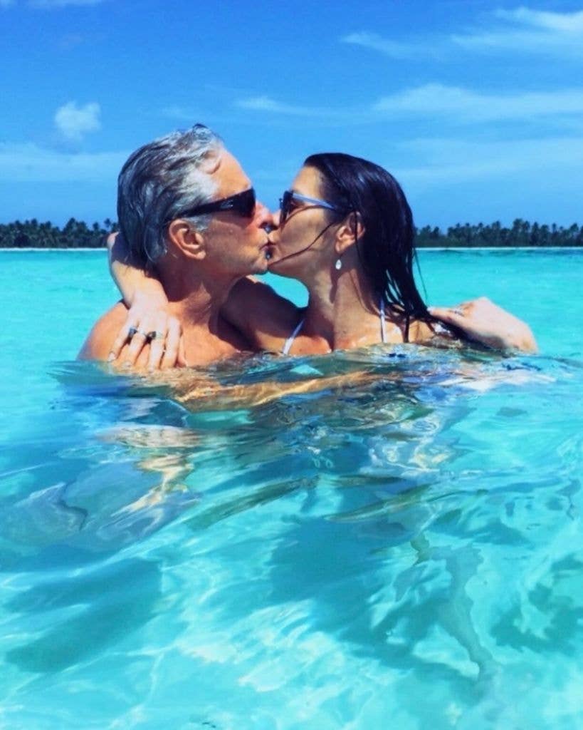 Catherine Zeta-Jones and Michael Douglas kissing in the ocean