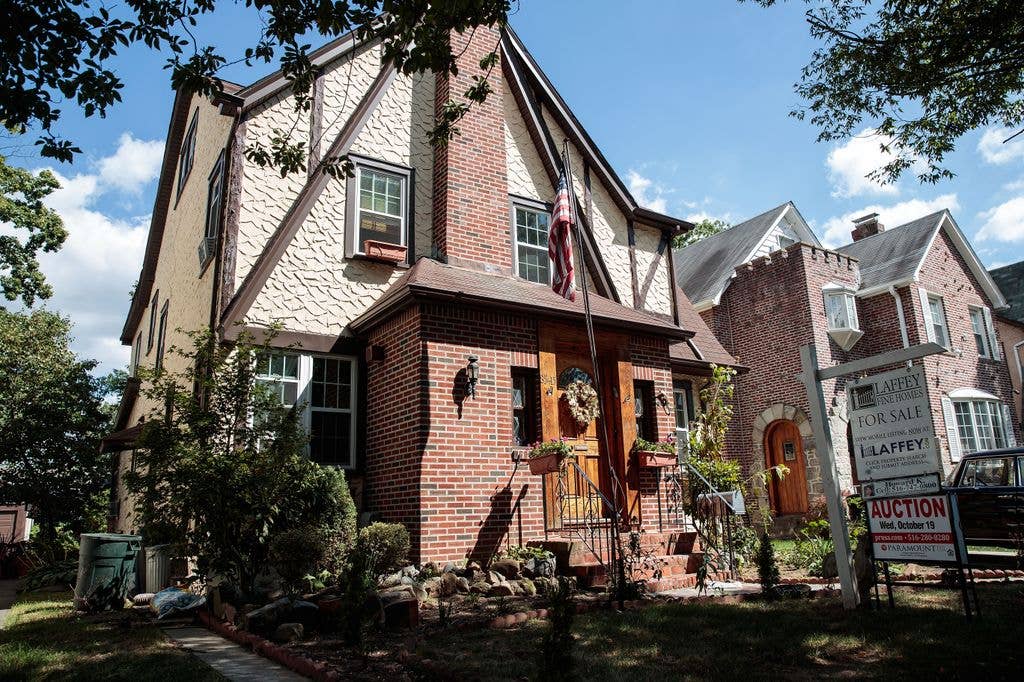 A view of Donald Trump's childhood home, September 12, 2016 in the in the Jamaica Estates neighborhood in the Queens borough of New York City. The home, a five-bedroom Tudor, will be up for auction on October 19th.