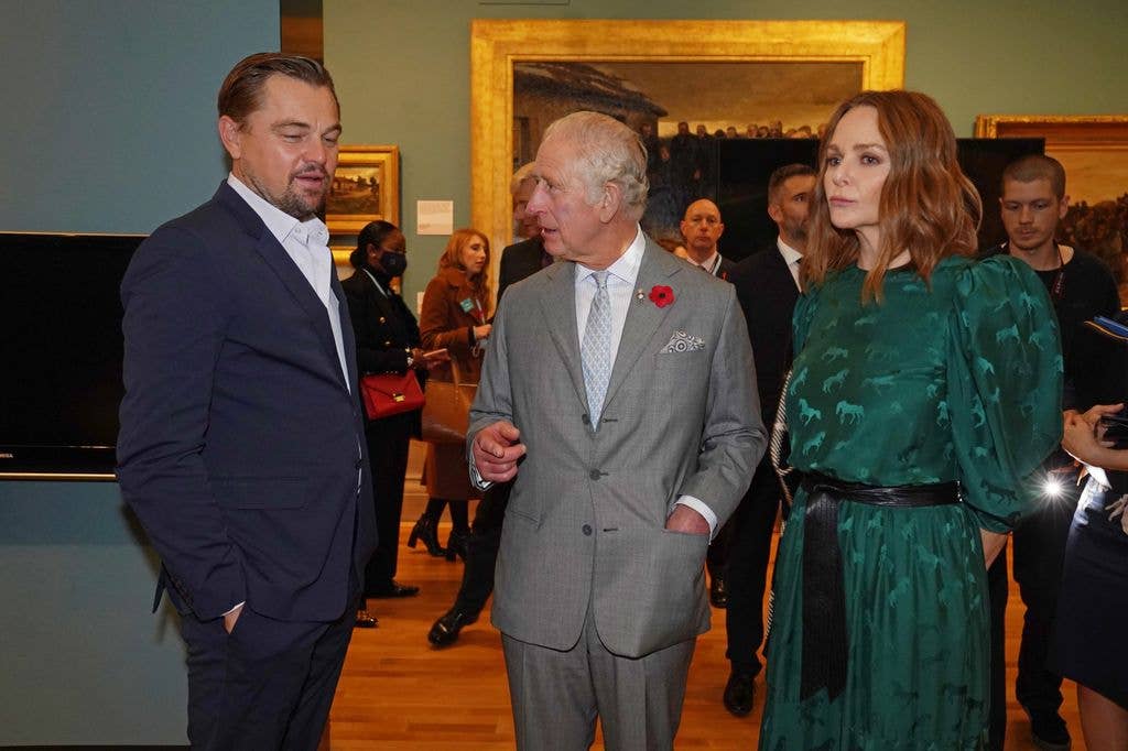 Prince Charles speaks to Leonardo DiCaprio as he views a fashion installation by designer Stella McCartney, at the Kelvingrove Art Gallery and Museum, during the Cop26 summit in 2021