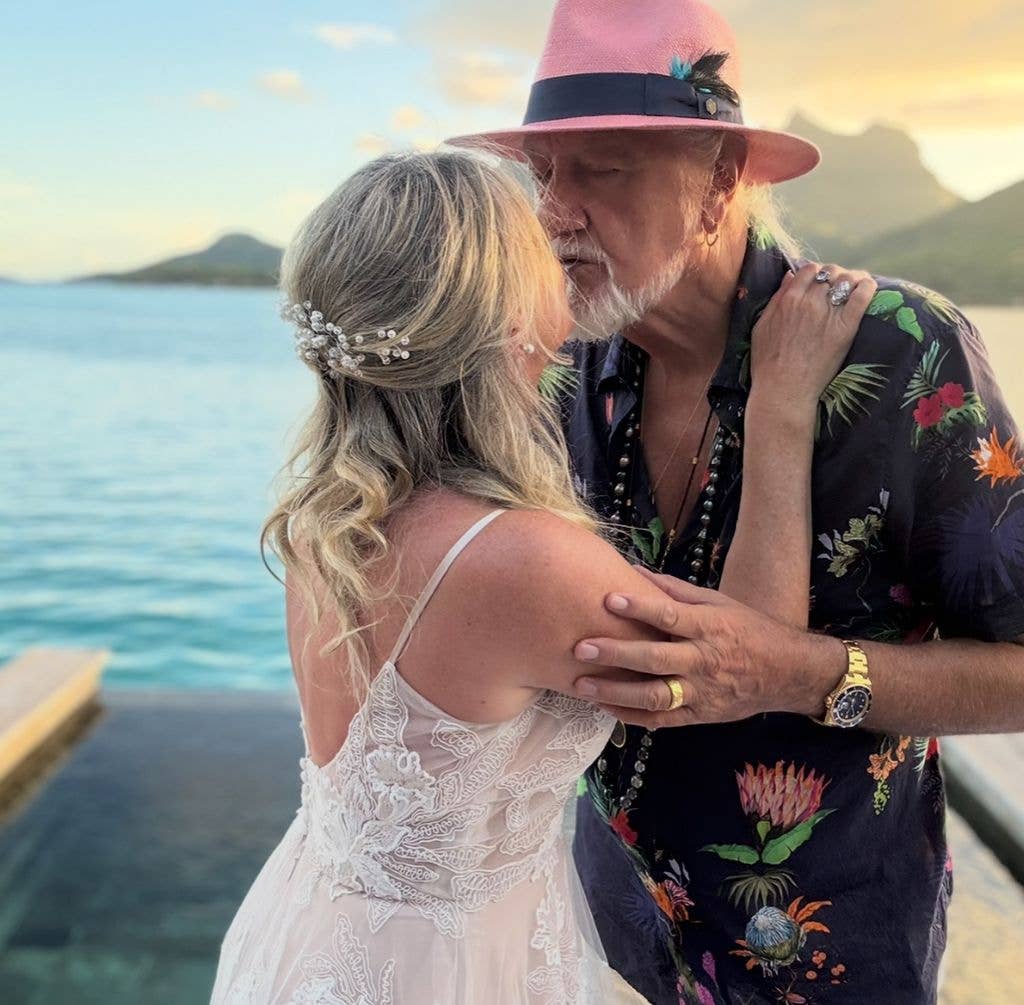 Mick Fleetwood kisses Elizabeth Jordan in wedding pictures