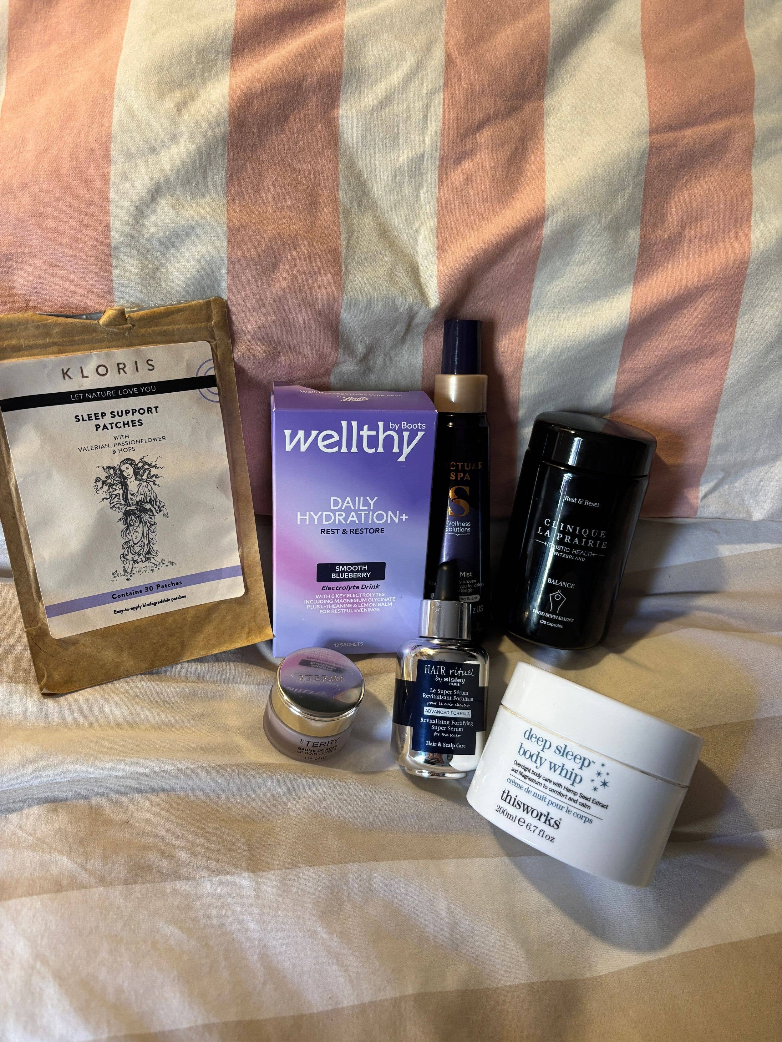 bedtime products on a striped bed