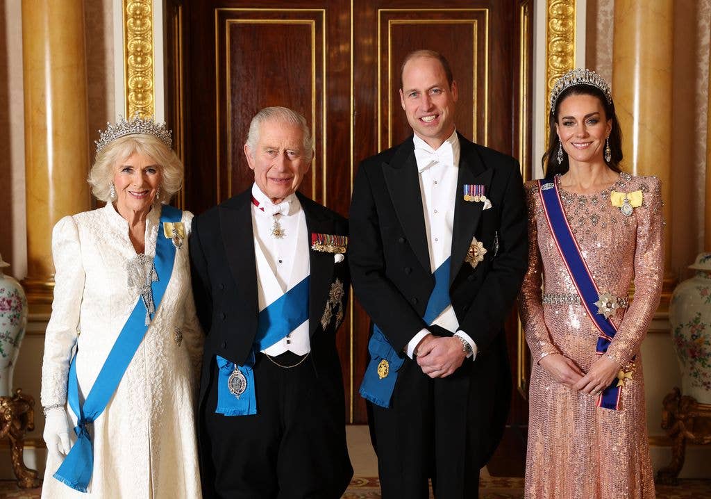 Queen Camilla, King Charles III, Prince William, Prince of Wales and Catherine, Princess of Wales pose for a photograph ahead of The Diplomatic Reception in the 1844 Room at Buckingham Palace on December 05, 2023