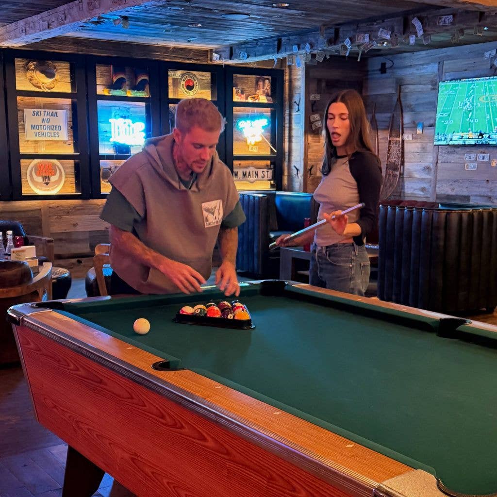 Hailey and Justin playing pool
