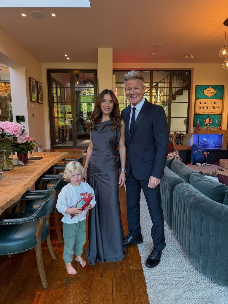 Gordon Ramsay and Tana Ramsay with a child in a living room setting.