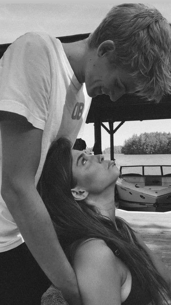 Presley Gerber looking down at Charlotte D'Alessio