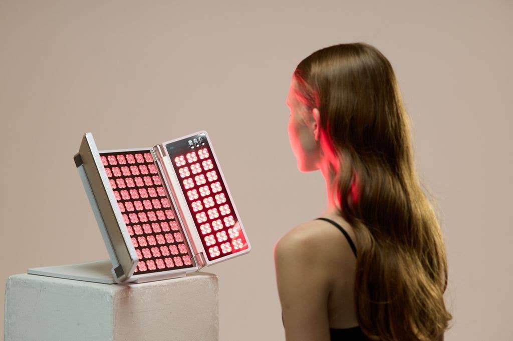 woman looking at LED light therapy panel