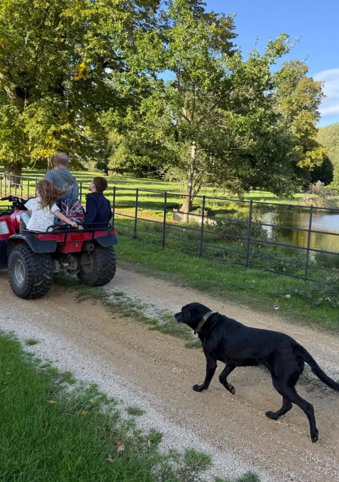Prince Harry, Prince Archie, and Princess Lilibet ride in a quad bike in picture taken by Meghan Markle