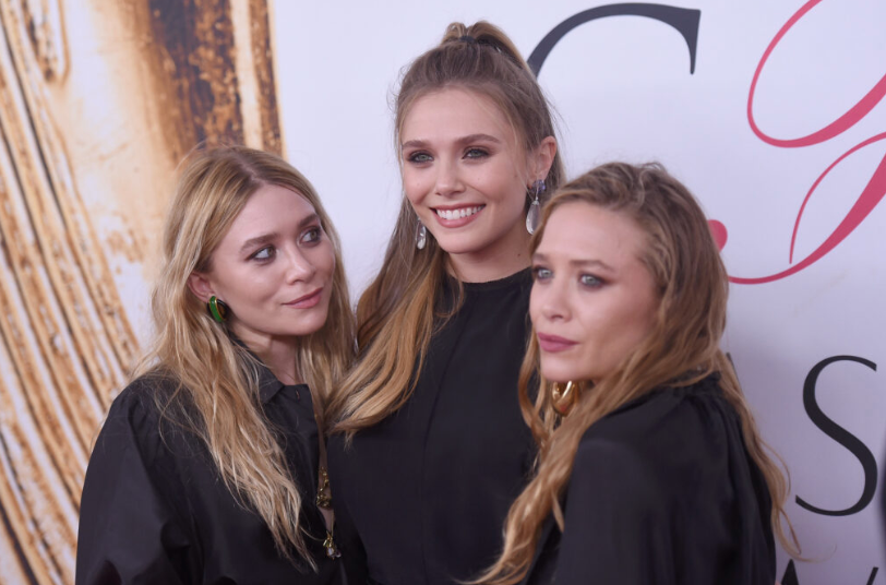 Elizabeth Olsen and Mary-Kate and Ashley Olsen smiling together