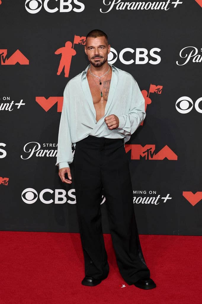 photo of ricky martin wearing unbuttoned shirt on red carpet