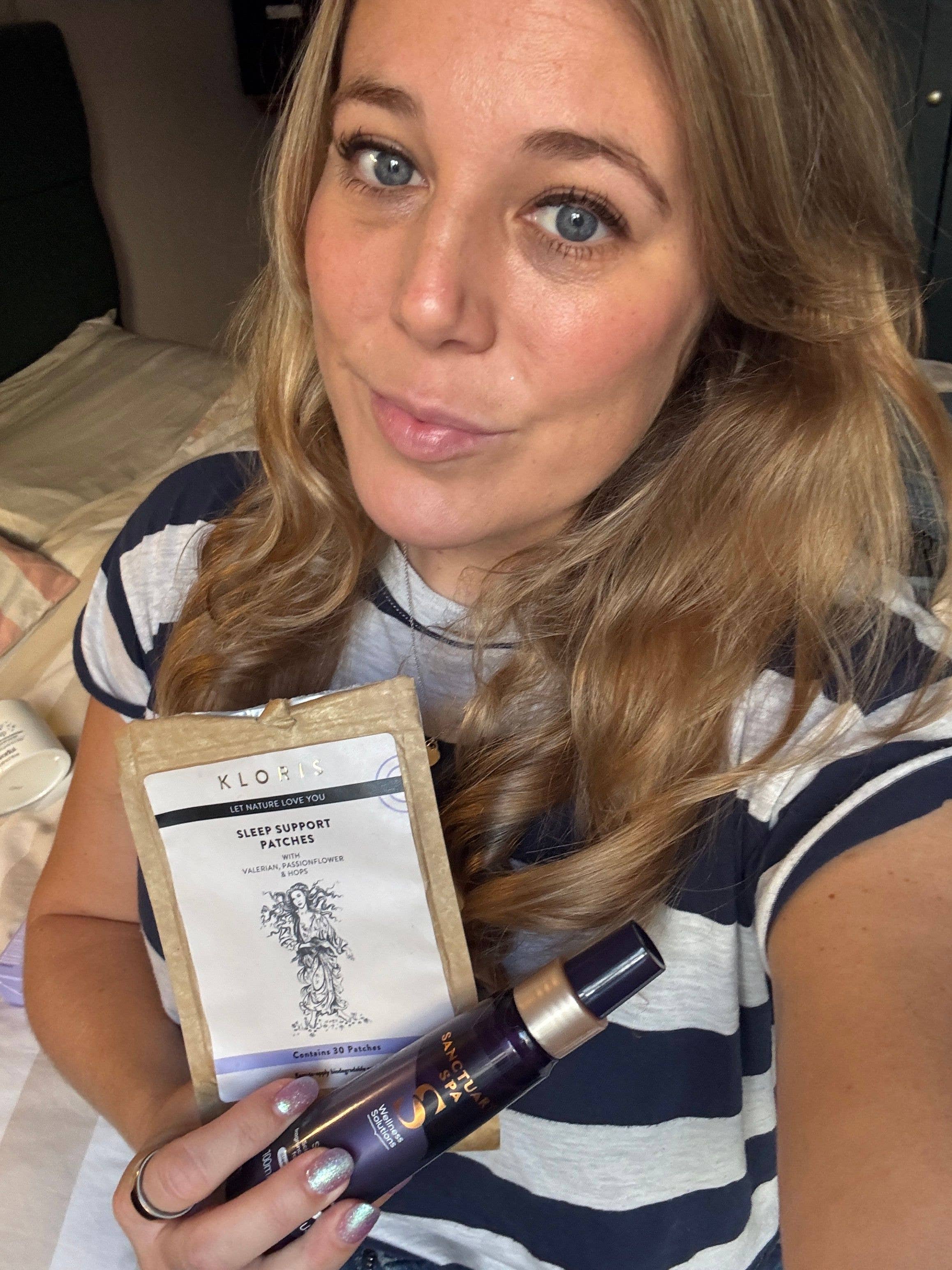 Mel holding two sleep products