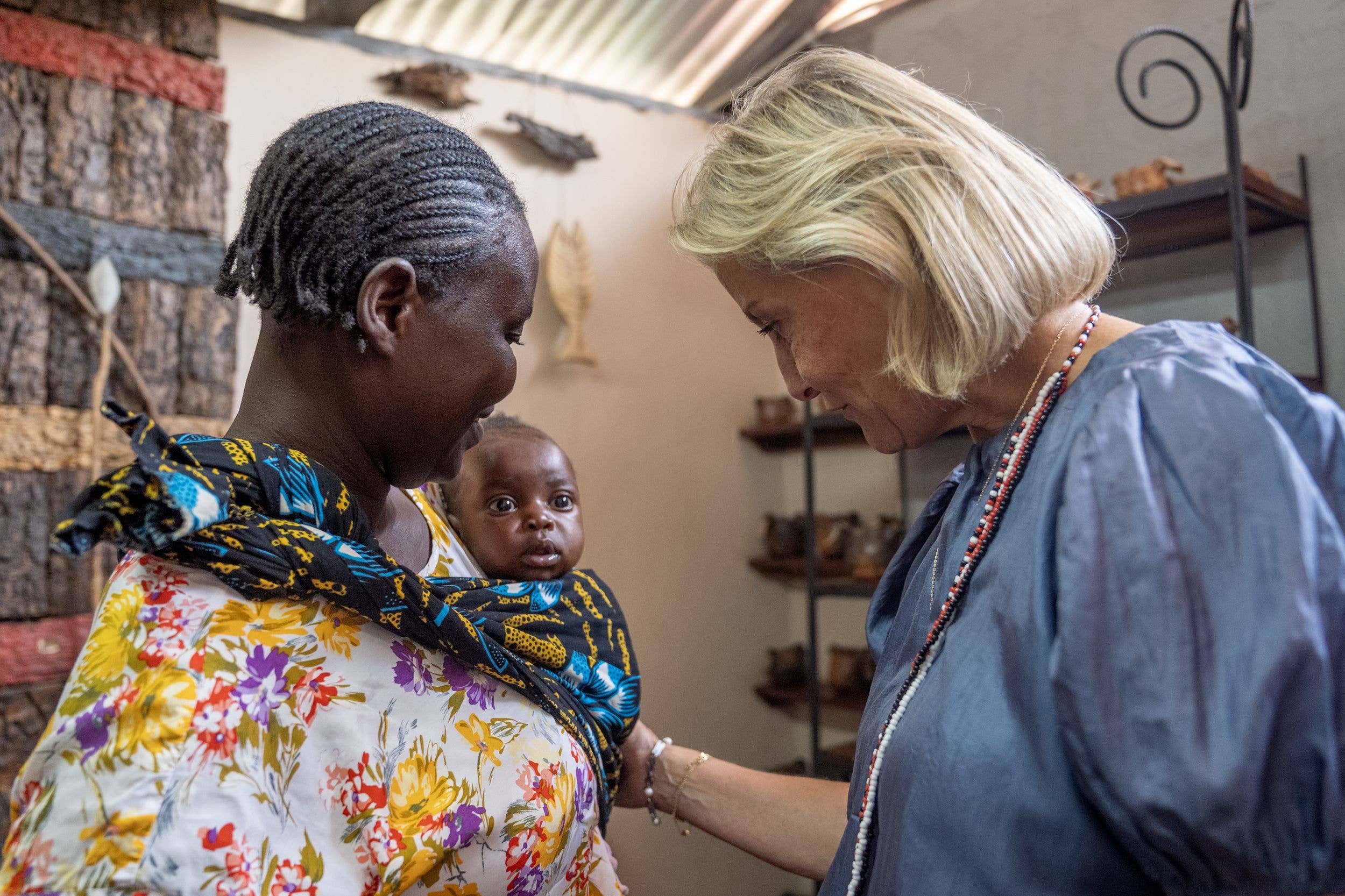 Sophie meets and artist and her four-month-old daughter during a visit to the Wayi Wayi Art Centre, in Livingstone Central