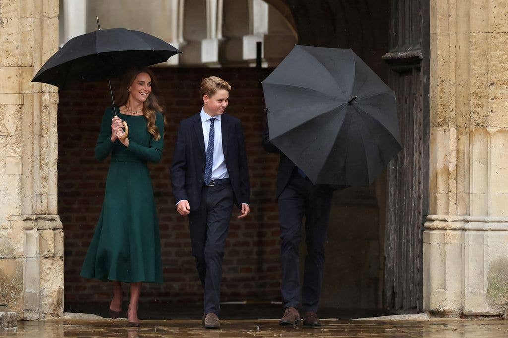 Princess Kate braved the rain with an umbrella in hand