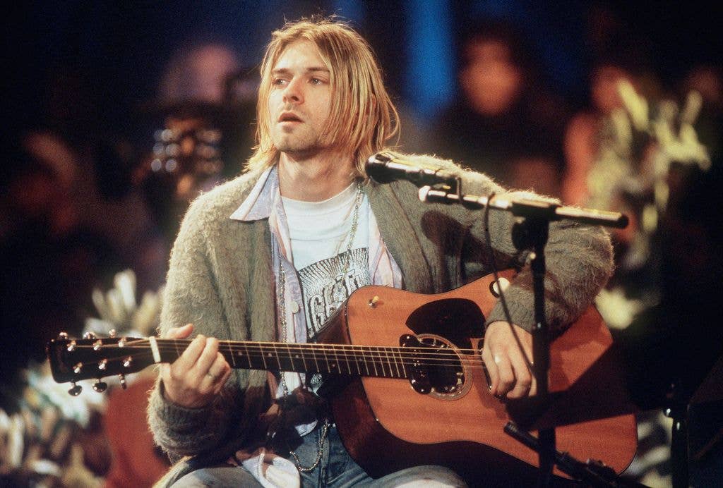 Kurt Cobain on stage with guitar