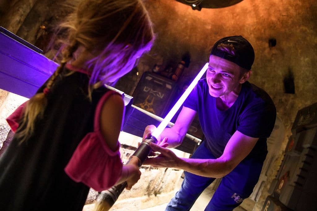 In this handout photo provided by Disneyland Resort, actor Hayden Christensen shares a moment with his daughter, on her birthday, after building a custom lightsaber in Savis Workshop at Star Wars: Galaxys Edge at Disneyland Park on October 29, 2019 in Anaheim, California.
