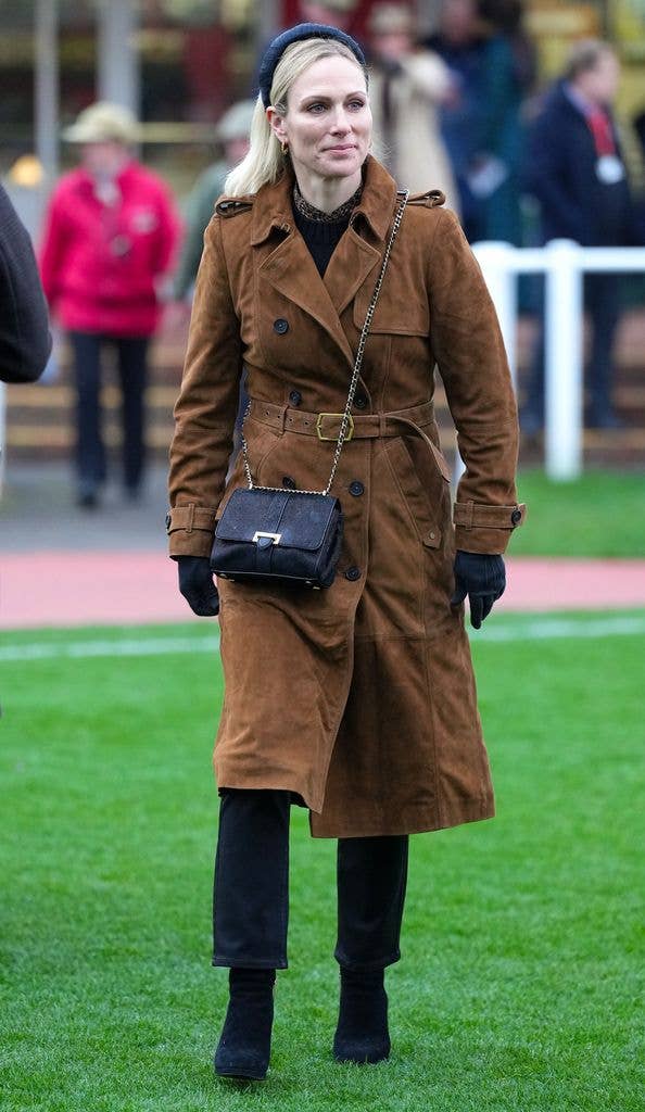 Zara wore her bag cross-body at the Cheltenham Racecourse in 2024