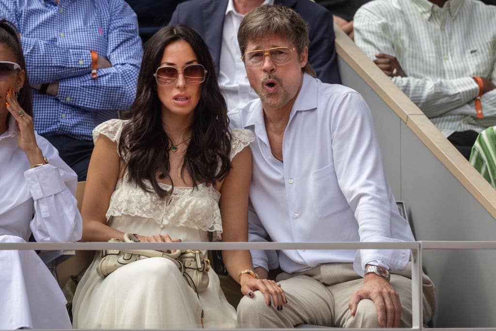 Brad Pitt pulling a face of shock while watching the tennis with his girlfriend Ines de Ramon