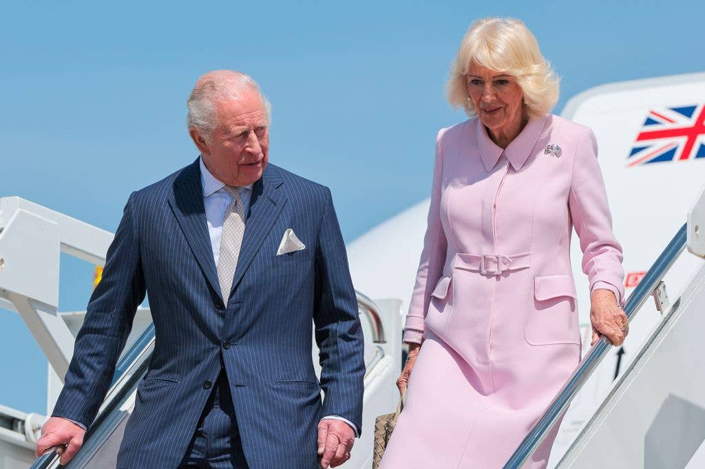 King Charles III and Queen Camila disembark their plane